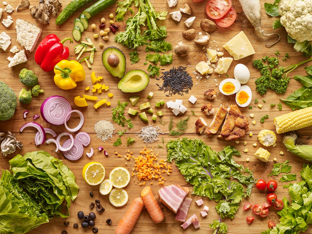 Protein-rich healthy foods including chicken, eggs, and legumes